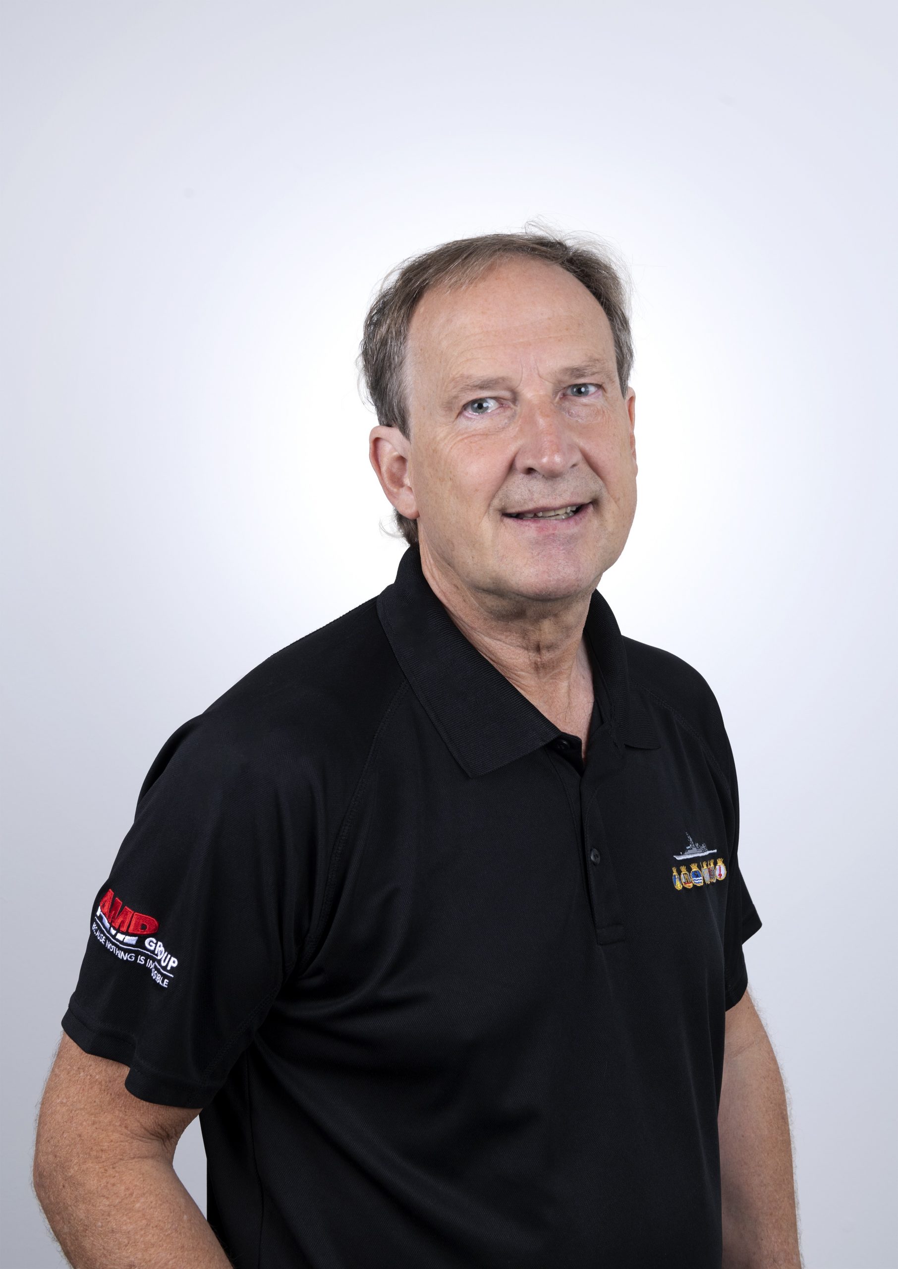 Gary Henderson - Financial Controller. Man wearing a black polo shirt.
